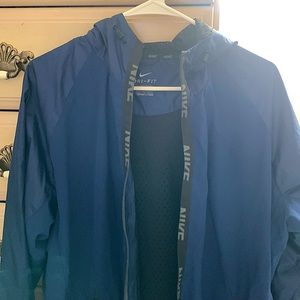 Navy blue Nike windbreaker in perfect condition.
